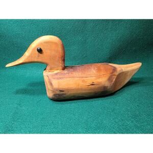 This carved wood duck is made from a driftwood log.